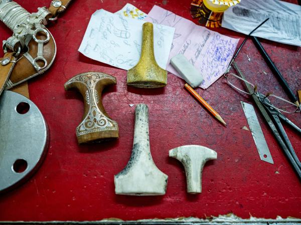 In Oman, a Dagger Symbolizes National Pride - SUR, OMAN-&shy;‐ NOVEMBER 21, 2022: Khanjar handles made from sandal wood, teak, whale bone...