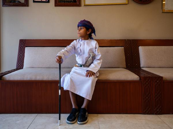 In Oman, a Dagger Symbolizes National Pride - SUR, OMAN-&shy;‐ NOVEMBER 21, 2022: Abdullah Al Farsi&#39;s son Abdulmalak, 8 in a massa...