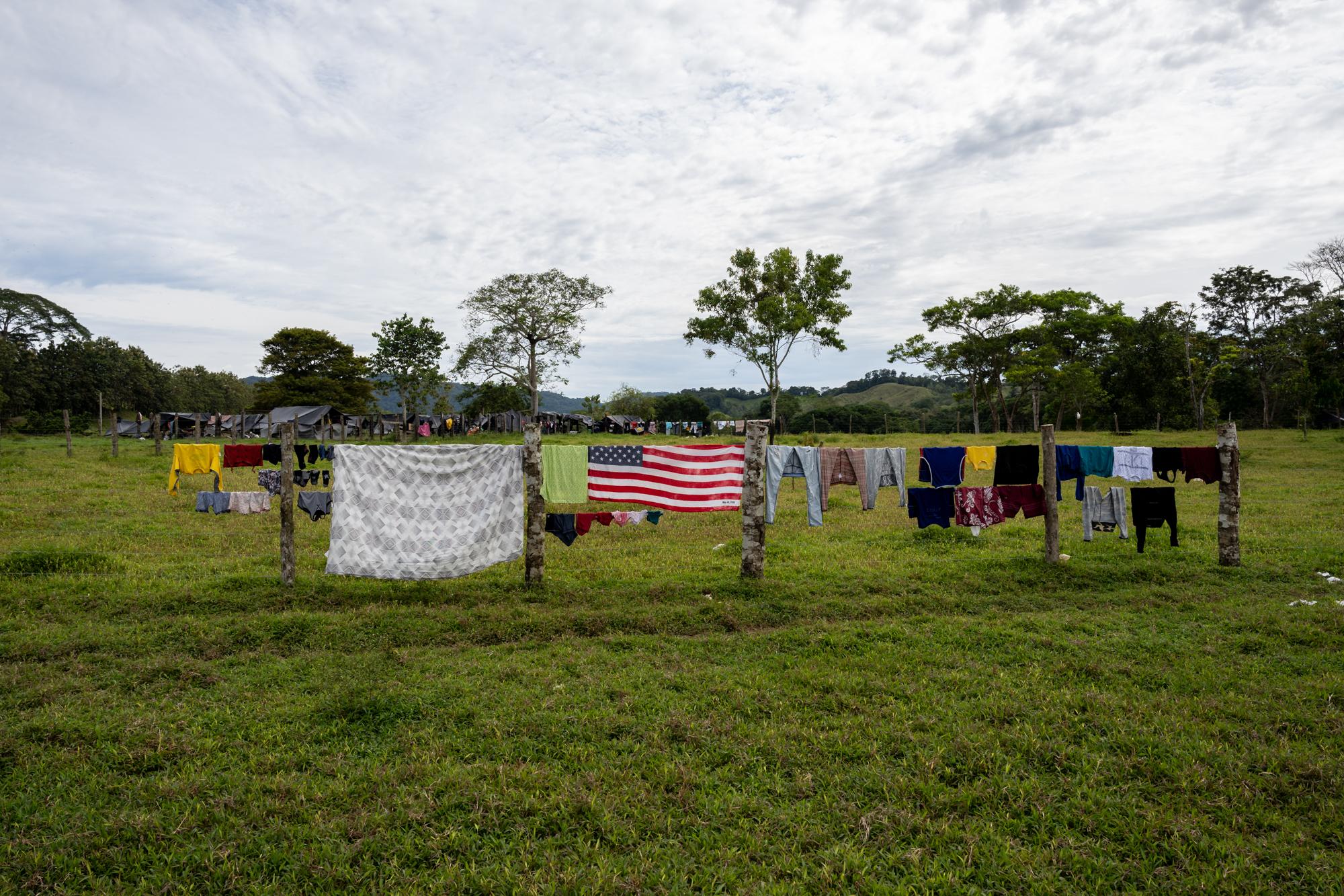 Inside The Derian Gap - A towel styled like the U.S. flag hangs on a wire fence...