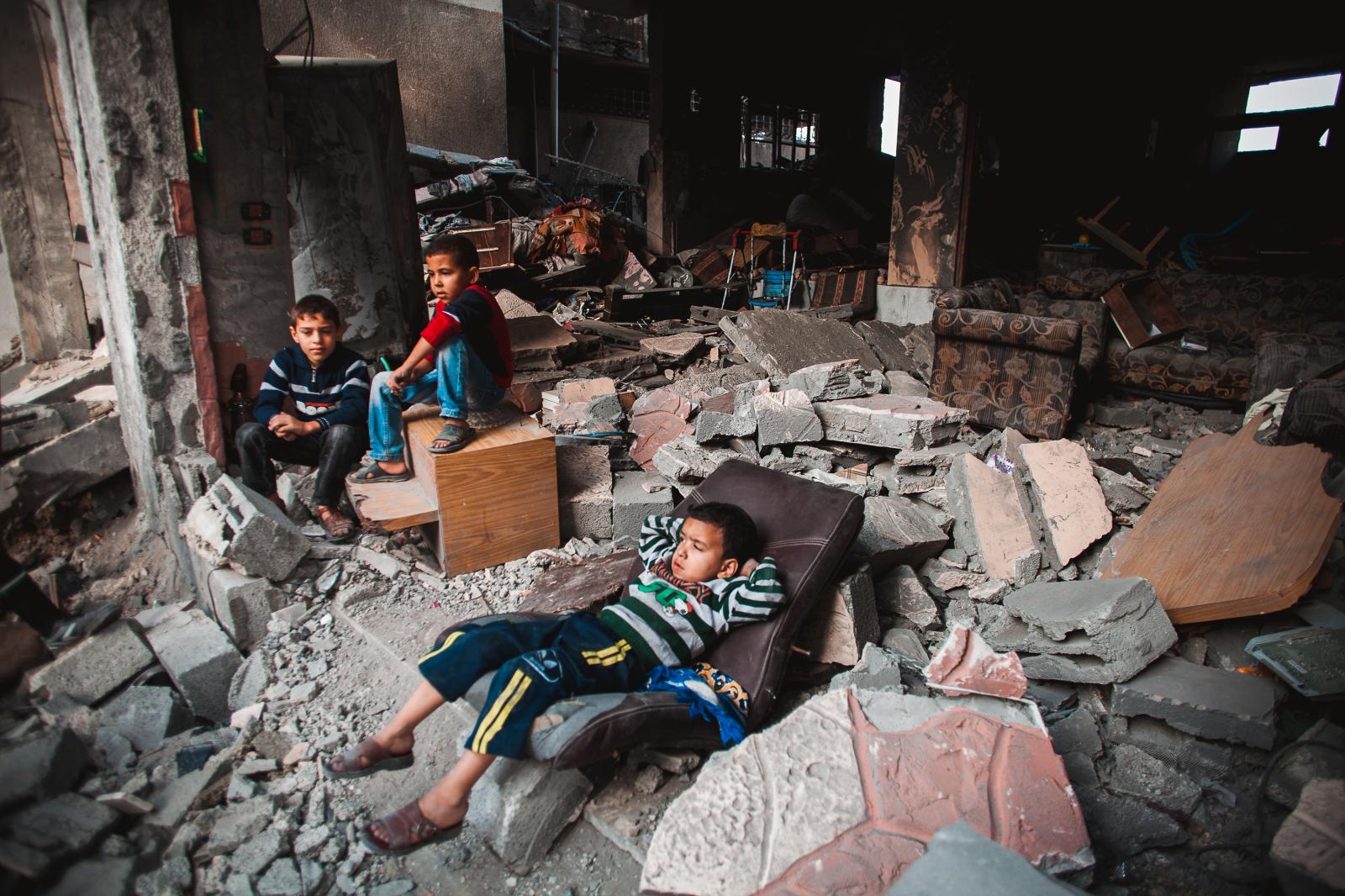 Gaza War 2012 - Palestinian children sitting between the ruins of their...