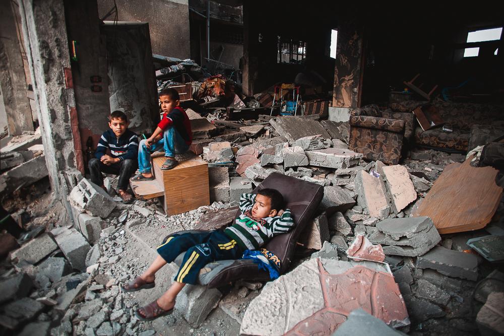 Gaza War 2012 - Baraa Azam lying infront of his destroyed house after an...