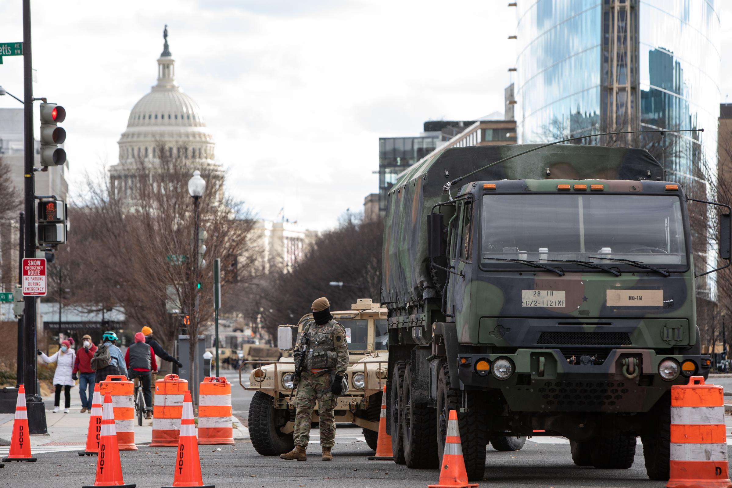 A member of the National Guard protects the perimeter fencing around the Capitol Hill during the...
