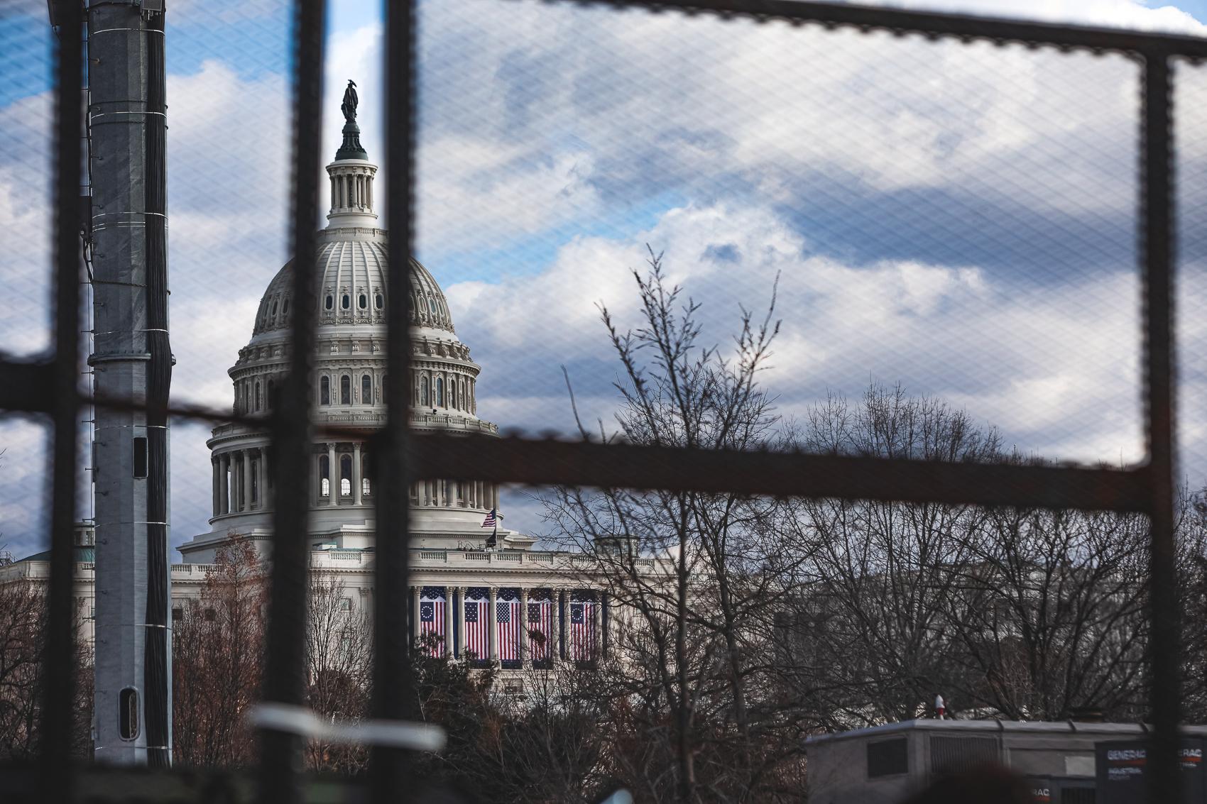 The Capitol dome is seen behind the security&nbsp;fencing around the Capitol Hill during the...