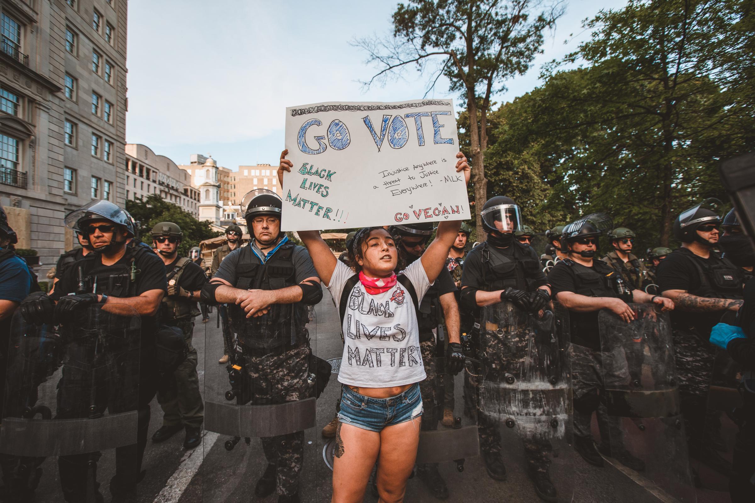WASHINGTON D.C., A demonstrator holding a sign that reads &ldquo;Go Vote&rdquo; during a...