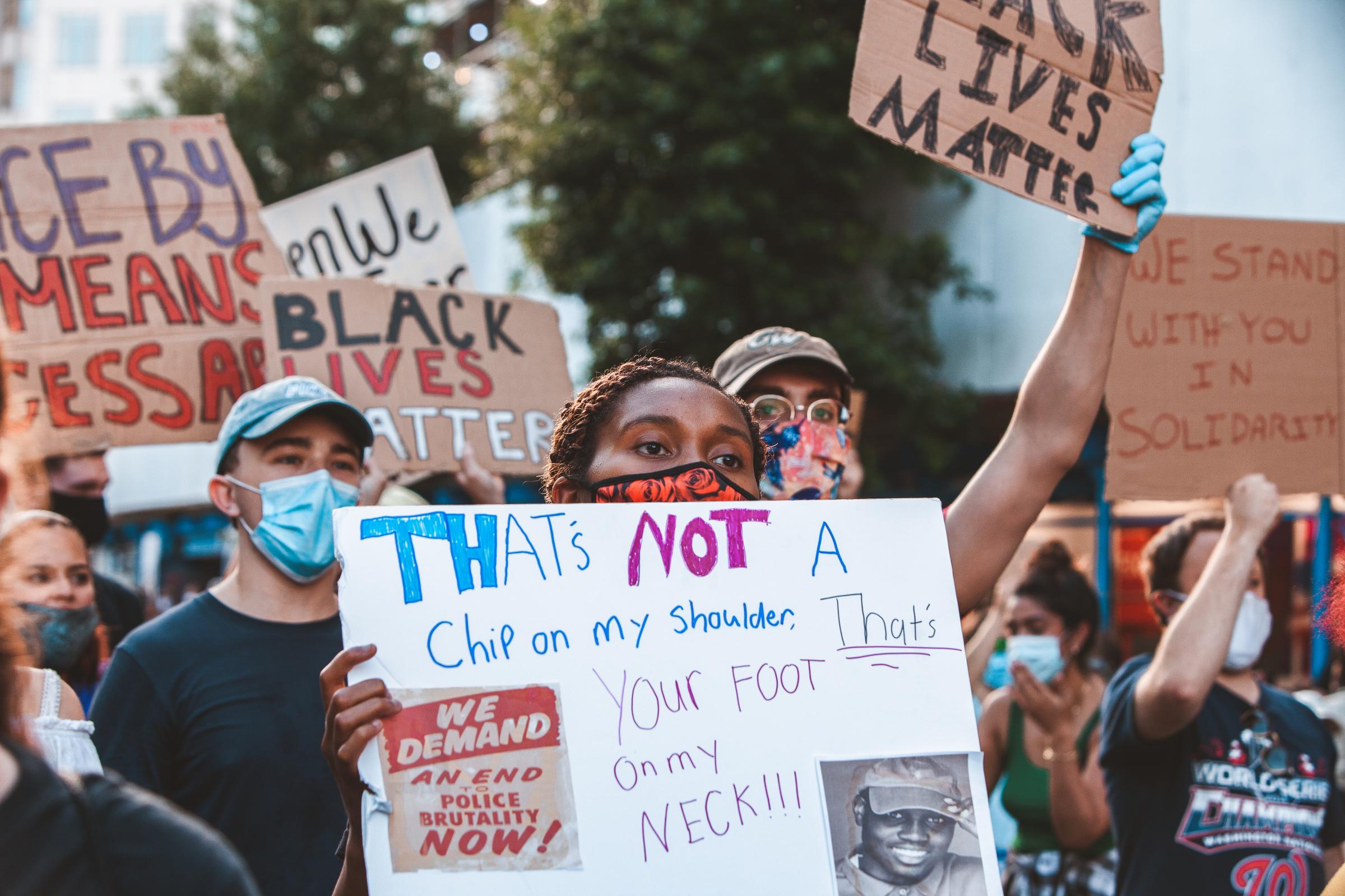 WASHINGTON D.C., Demonstrators holding signs in support of Black Lives Matter movement during a...