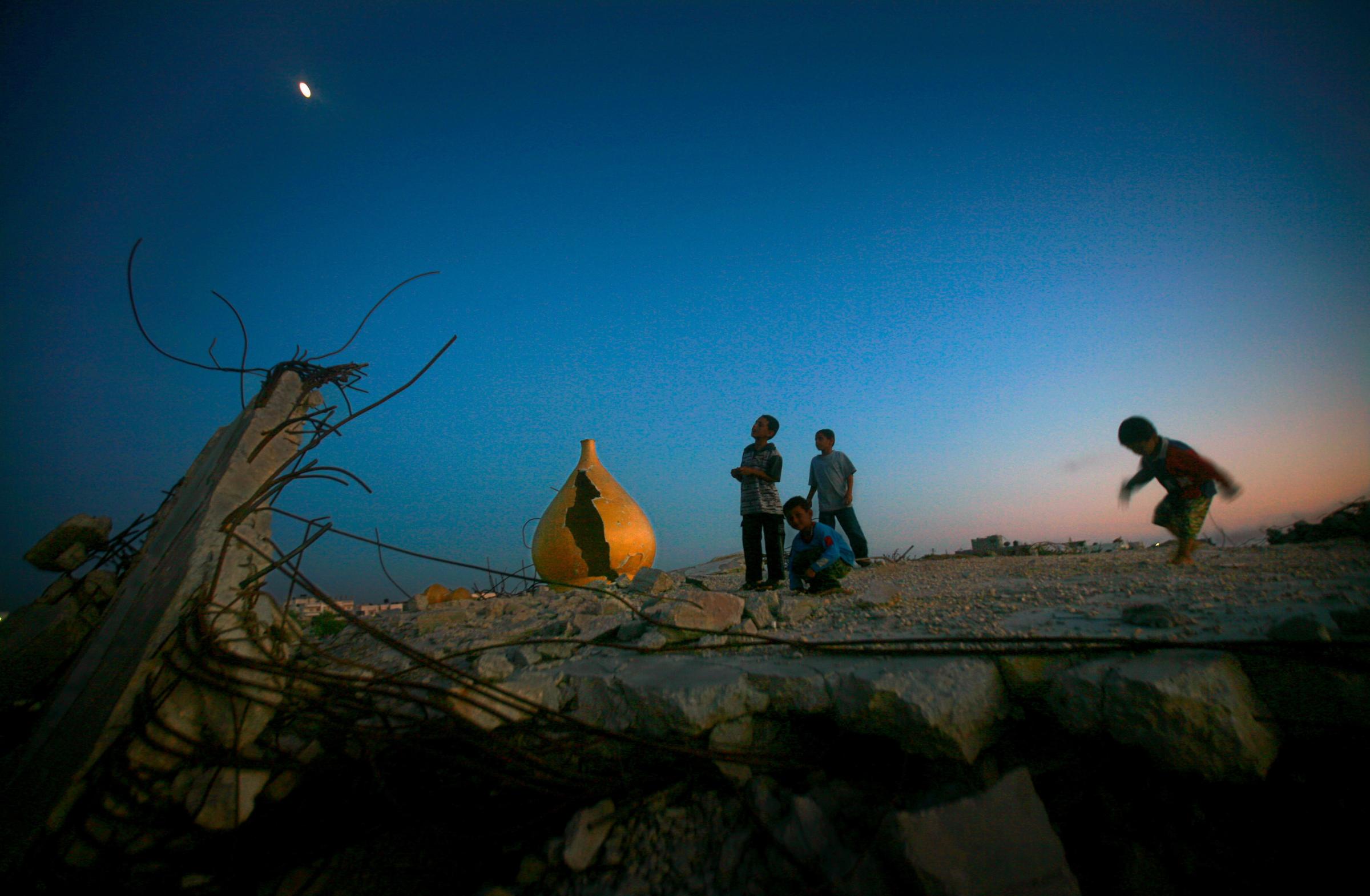 What Lies Beneath The Rubble  - GAZA STRIP, PALESTINE.Palestinian children play in the...