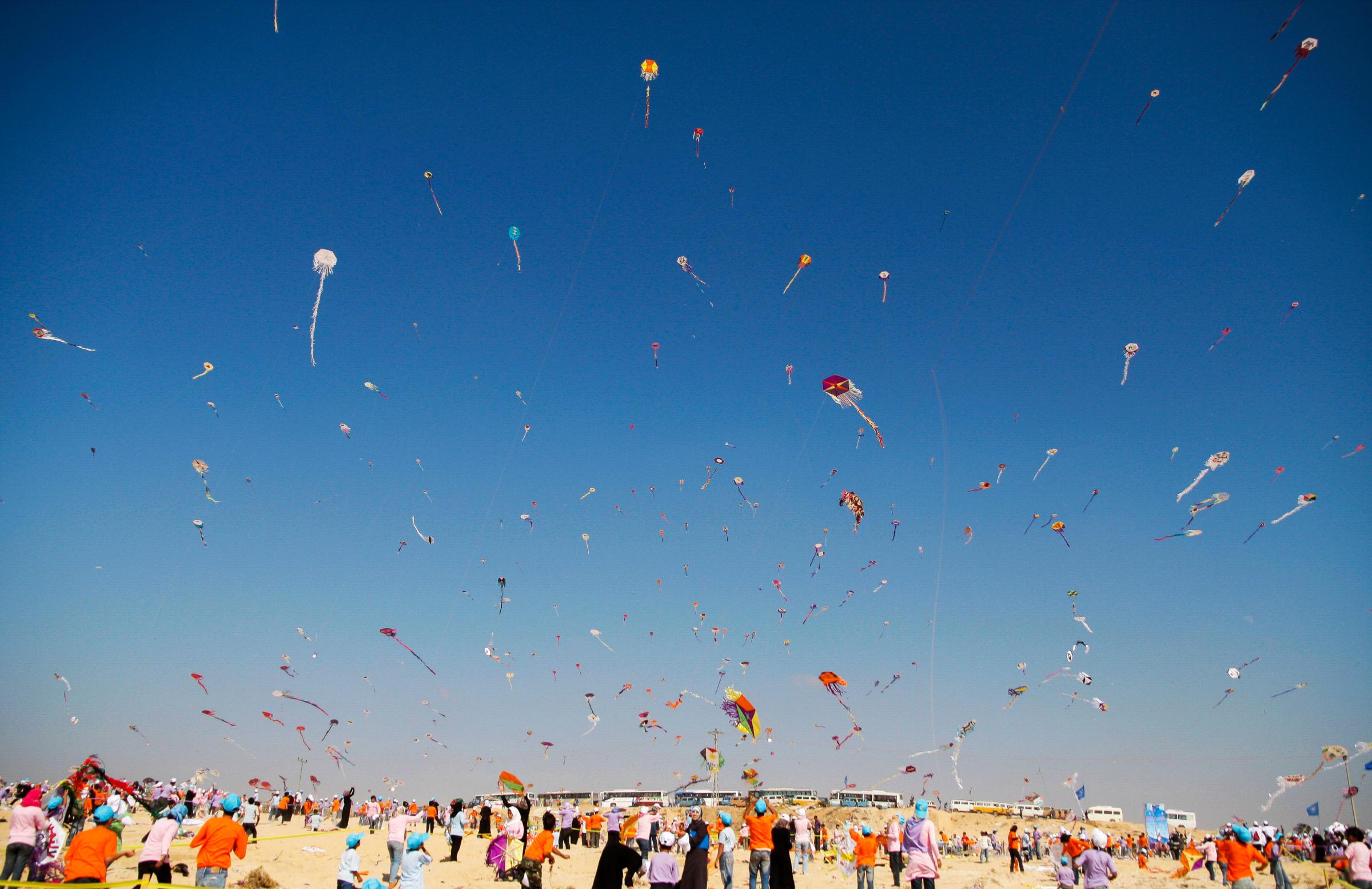 Gazan children attempt to break the Guinness World Record of total number of kites flown at one time. Around 6000 kites were flown on a Gazan beach...