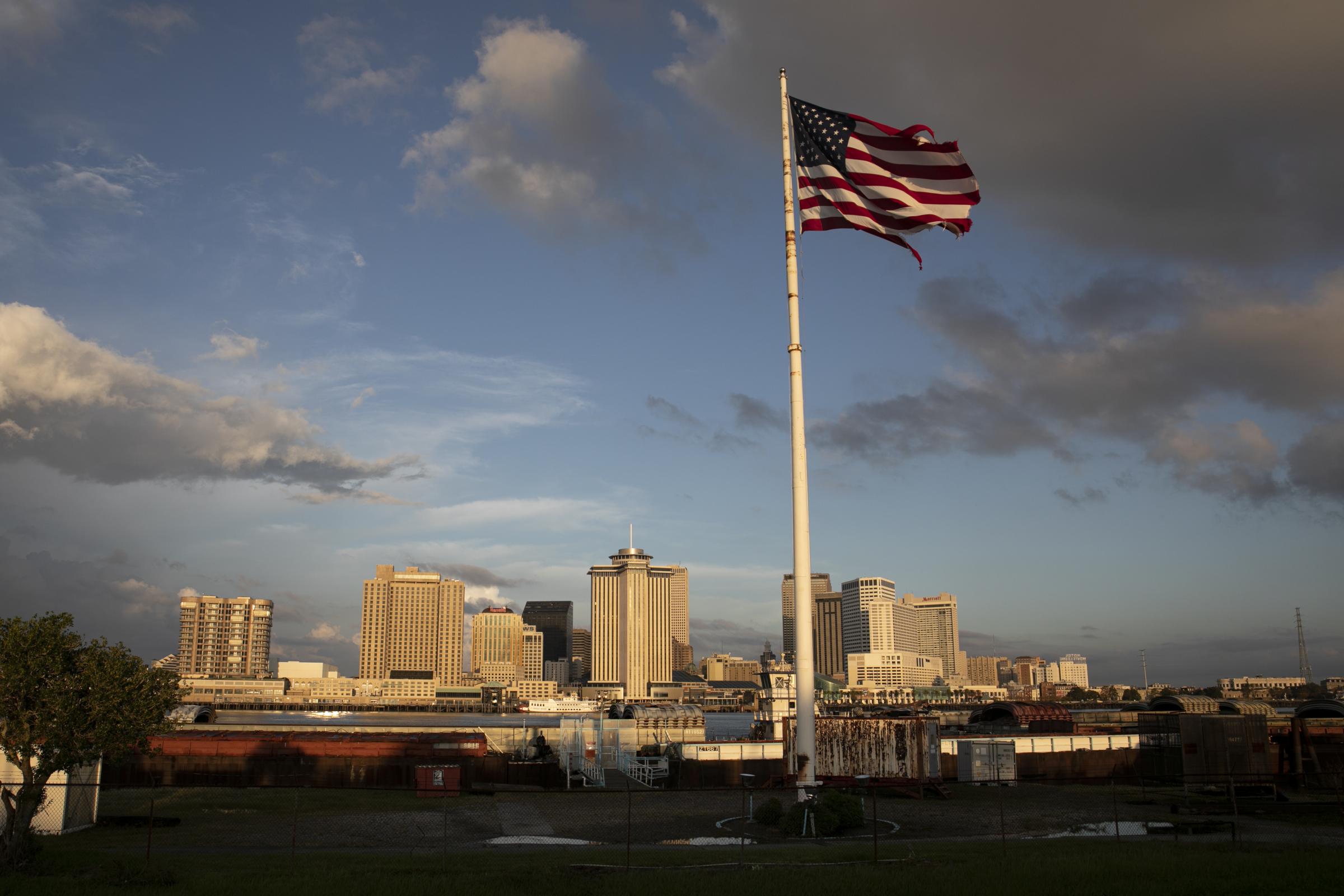 slideshow - A view of downtown New Orleans at dawn during a blackout in the city after Hurricane Ida made...