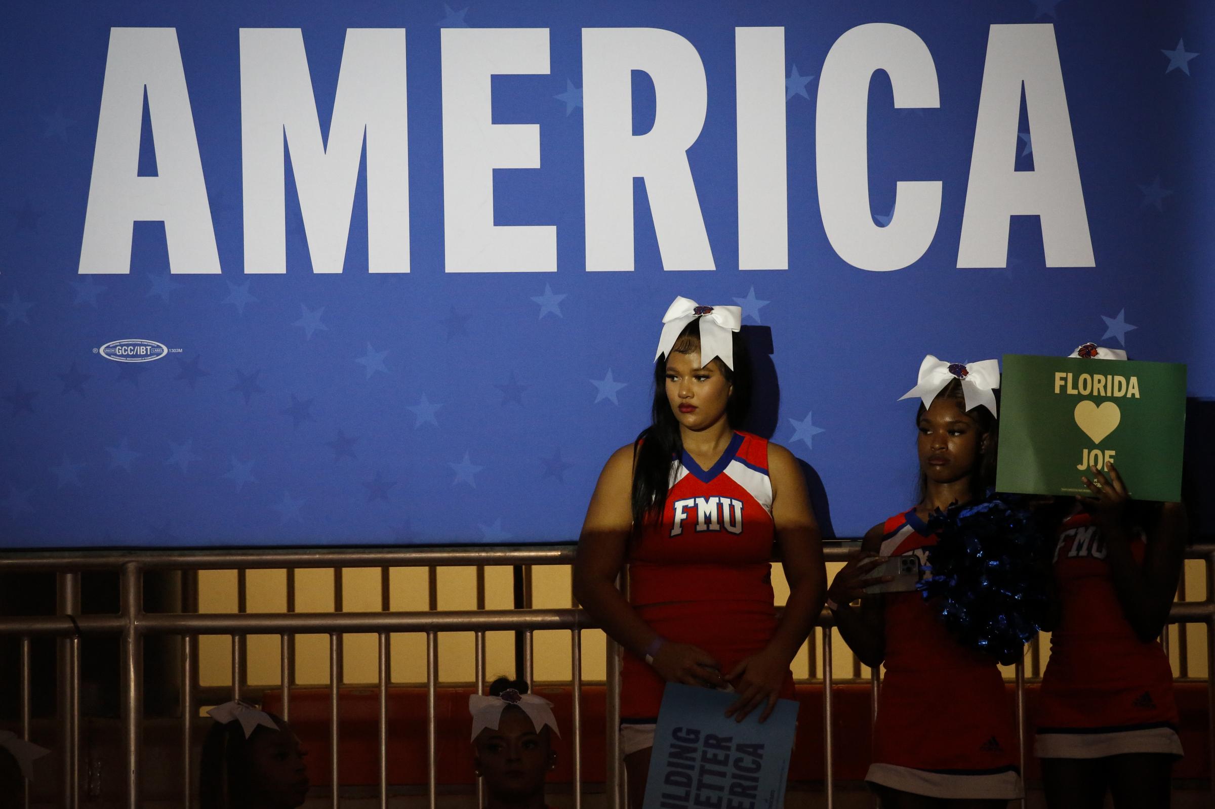 slideshow - People wait for U.S. President Joe Biden to speak during a campaign rally for the Democratic...