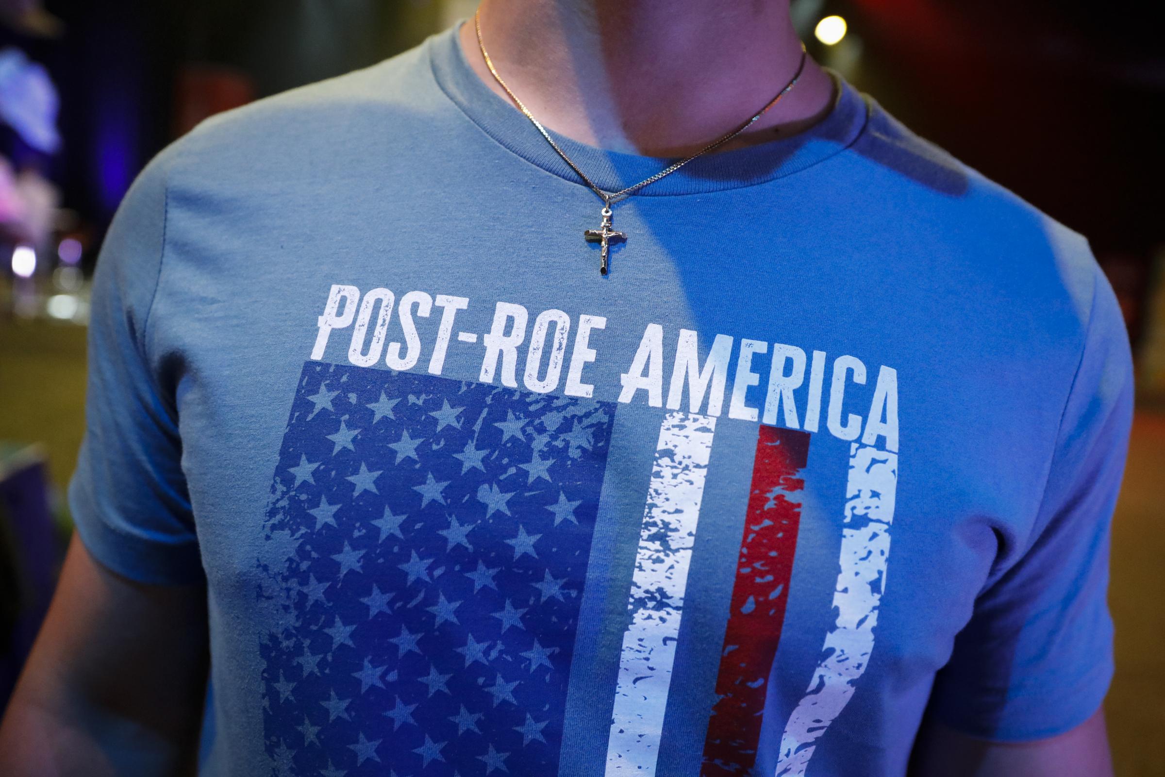 slideshow - A detail on the t-shirt of an anti-abortion supporter at the Turning Point USA’s (TPUSA) Student...