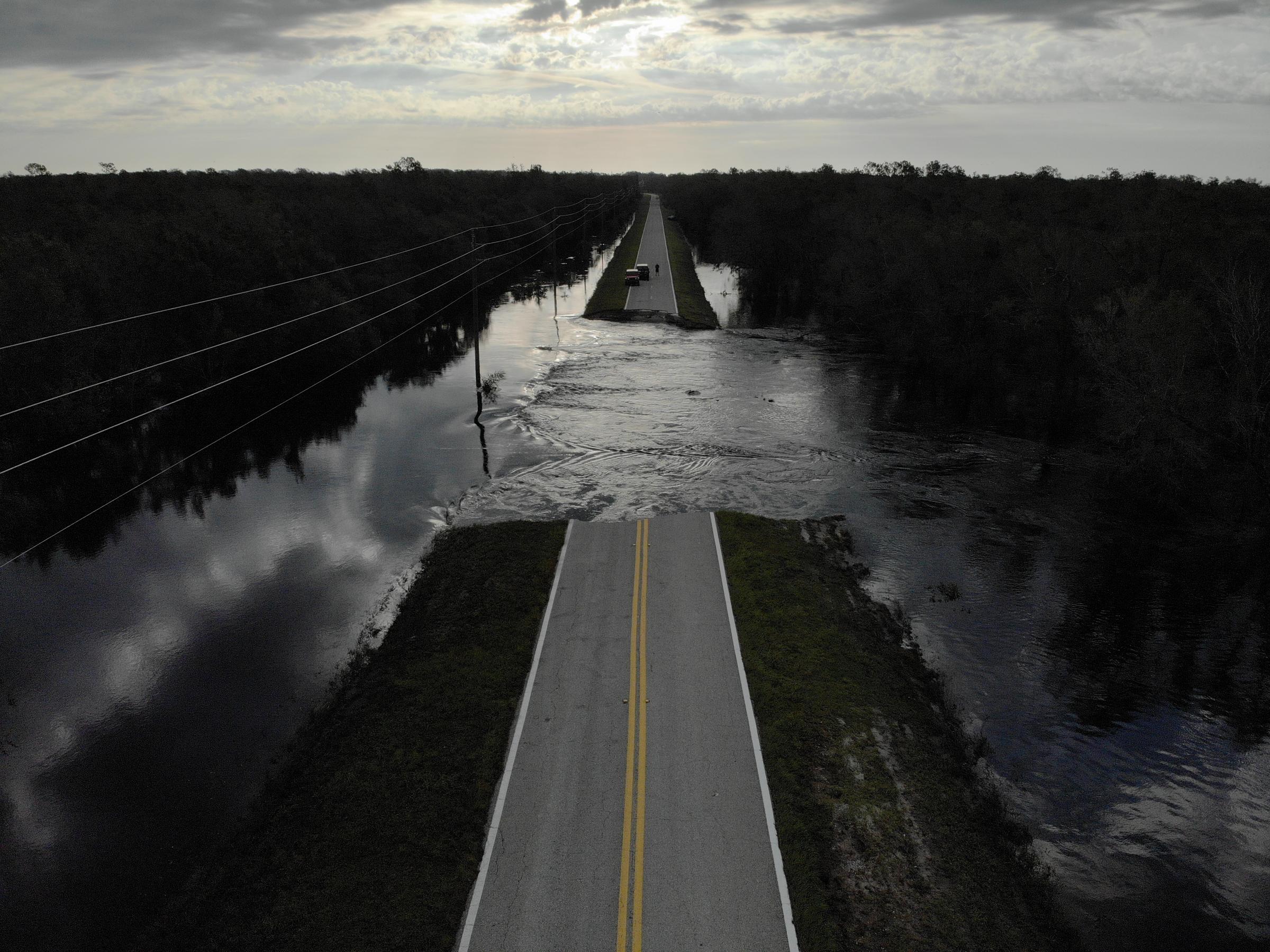 slideshow - A destroyed road is seen after Hurricane Ian caused widespread destruction in Brownville,...