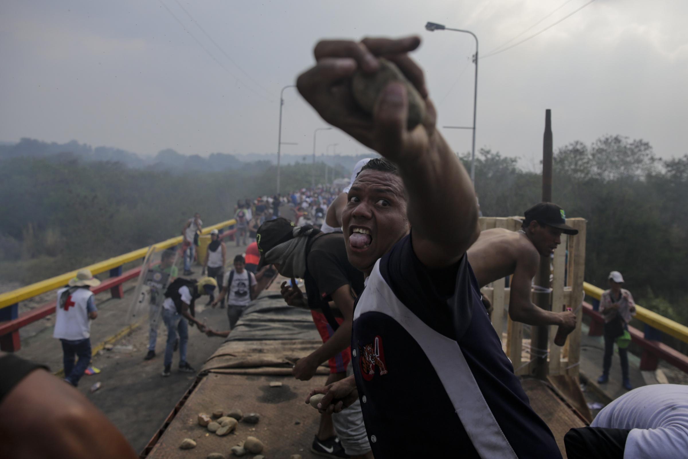 slideshow - Opposition supporters clash with Venezuela's security forces at Francisco de Paula Santander...