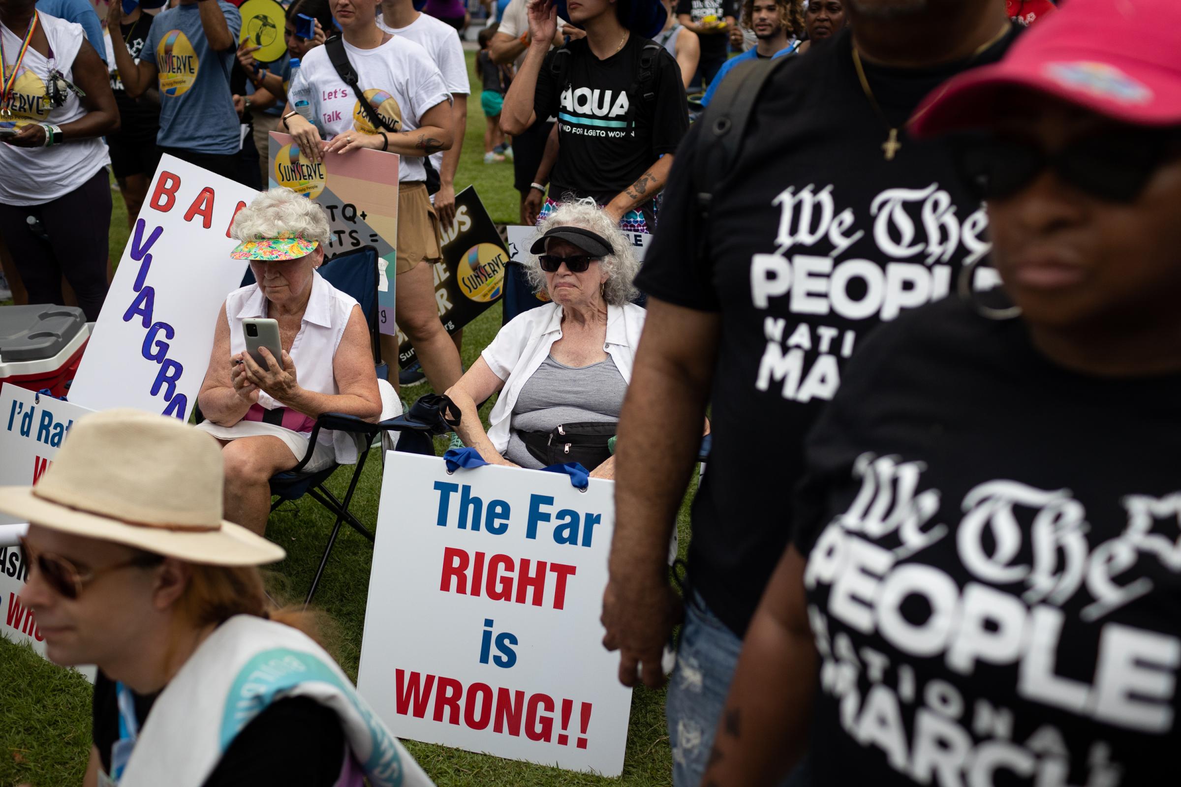 People attend the rally "We The People National March"to stand up for fundamental human rights at Esplanade Park, in Fort Lauderdale,...