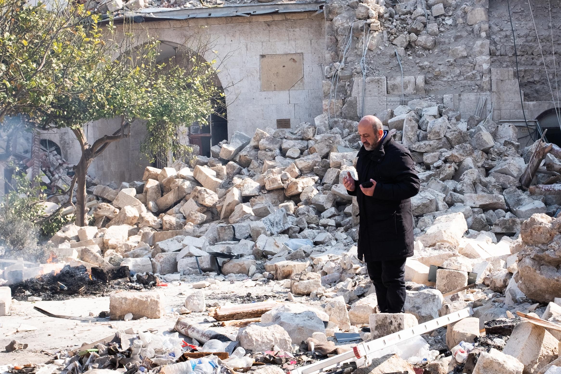 Earthquake in Turkey - Turquie, Antakya, 2023-02-11. A man pray in the ruins of...