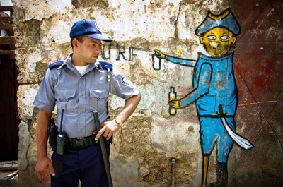 Image from Singles -  Policemen and graffiti in Havana, Cuba 