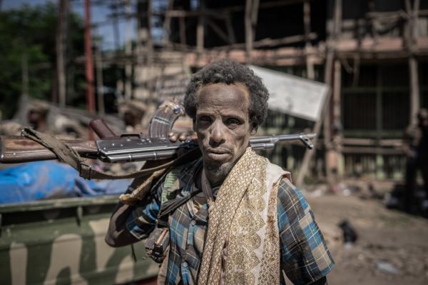 Amanuel Sileshi | Searching for Peace Amidst Chaos -  A member from the Afar militia pose for a photograph in...