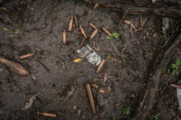 Amanuel Sileshi | Searching for Peace Amidst Chaos -  Spent bullet casings are seen on the ground near a mass...