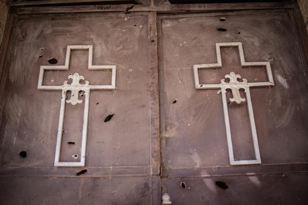 Amanuel Sileshi | Searching for Peace Amidst Chaos - The doors of a church allegedly damaged by Tigrayan...