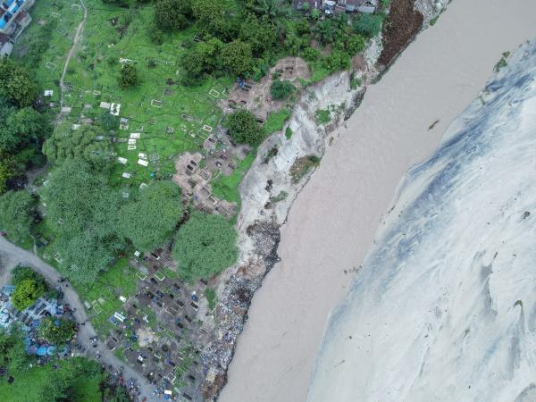 Image from Ericky Boniphace | Even The Dead can't Escape Climate Change -  An aerial view of Vingunguti cemetery and the Msimbazi...