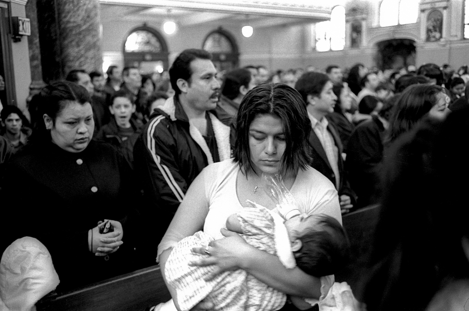 Coming of Age - Miriam holds one of her children during Easter...