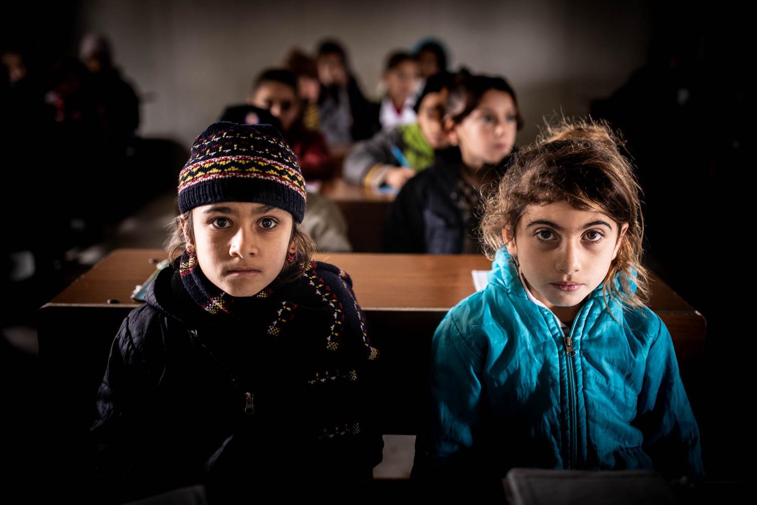 Education Whilst Displaced - Mena and Amal attend an Arabic lesson in a makeshift...