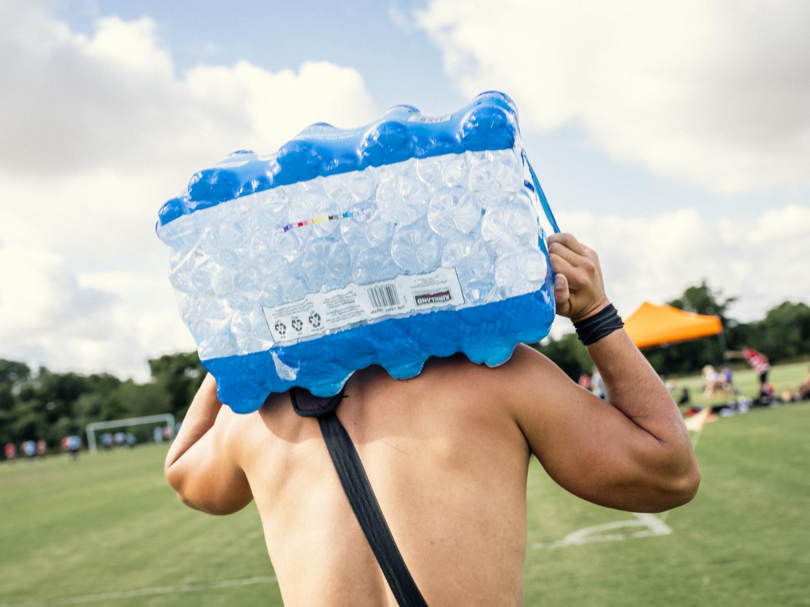  Sergio Palacios, 35, carries a...mperature reached 101 degrees. 