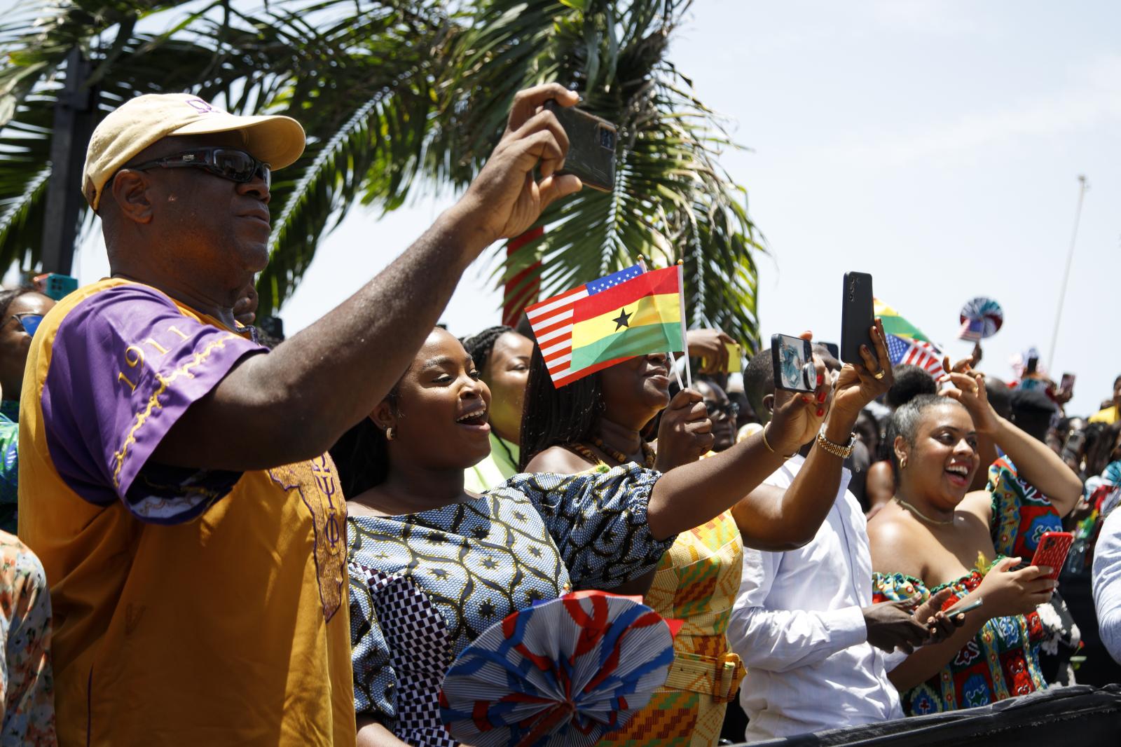 Image from U.S. Vice President Kamala Harris Visit To Ghana - People cheer as they listen to U.S. Vice President Kamala...
