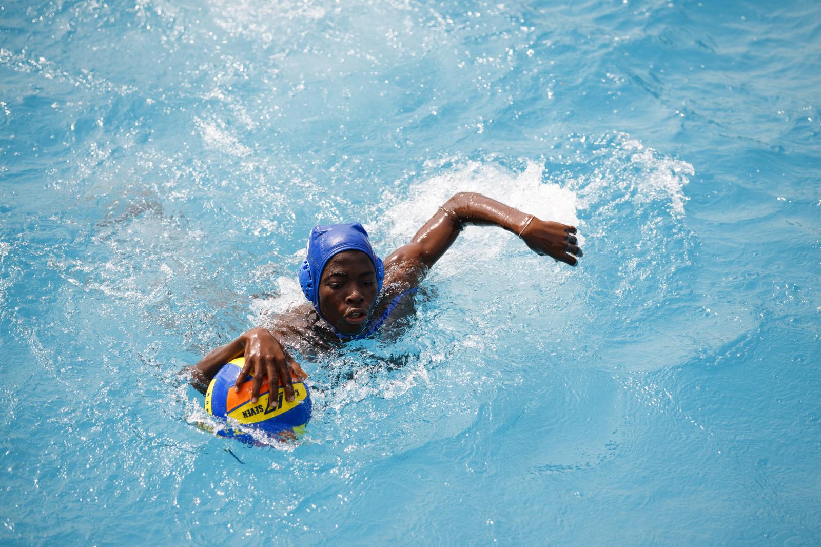 Image from Water Polo - A player from the youth team warm-up ahead of the Black...