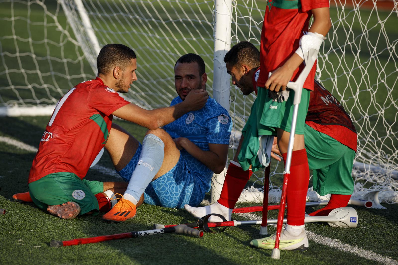 Image from First African Para Games  - Moroccan amputee football players console their...