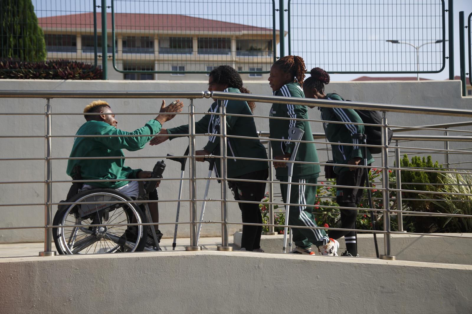 Image from First African Para Games  - Para athletes interact on the walkway at the first...