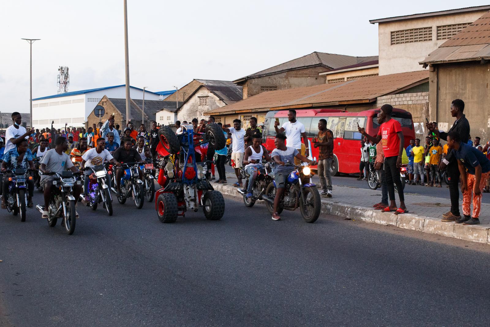 Motorcycle stunts on the streets of Jamestown in Accra, Ghana.