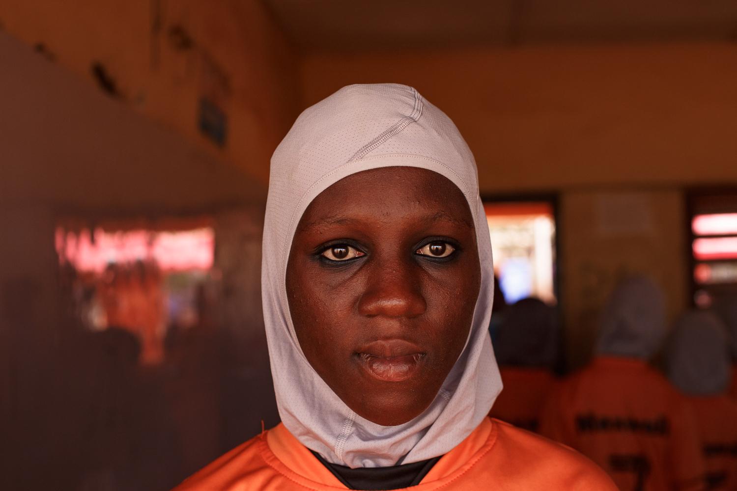 Image from Faith and Football - Rashida, 15years old, poses for a photograph in a Hijab...