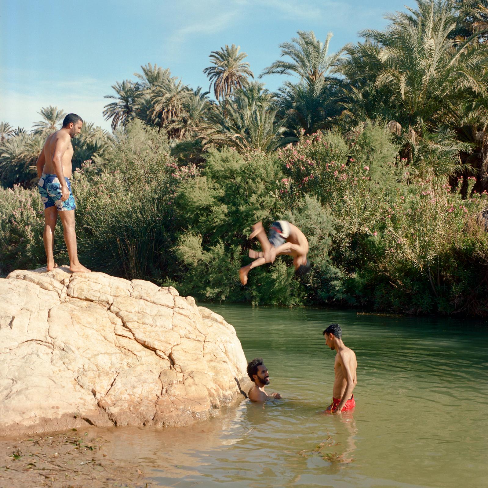 Before it's gone  - Youth swimming in oued Sayad at Taghjijt Oasis