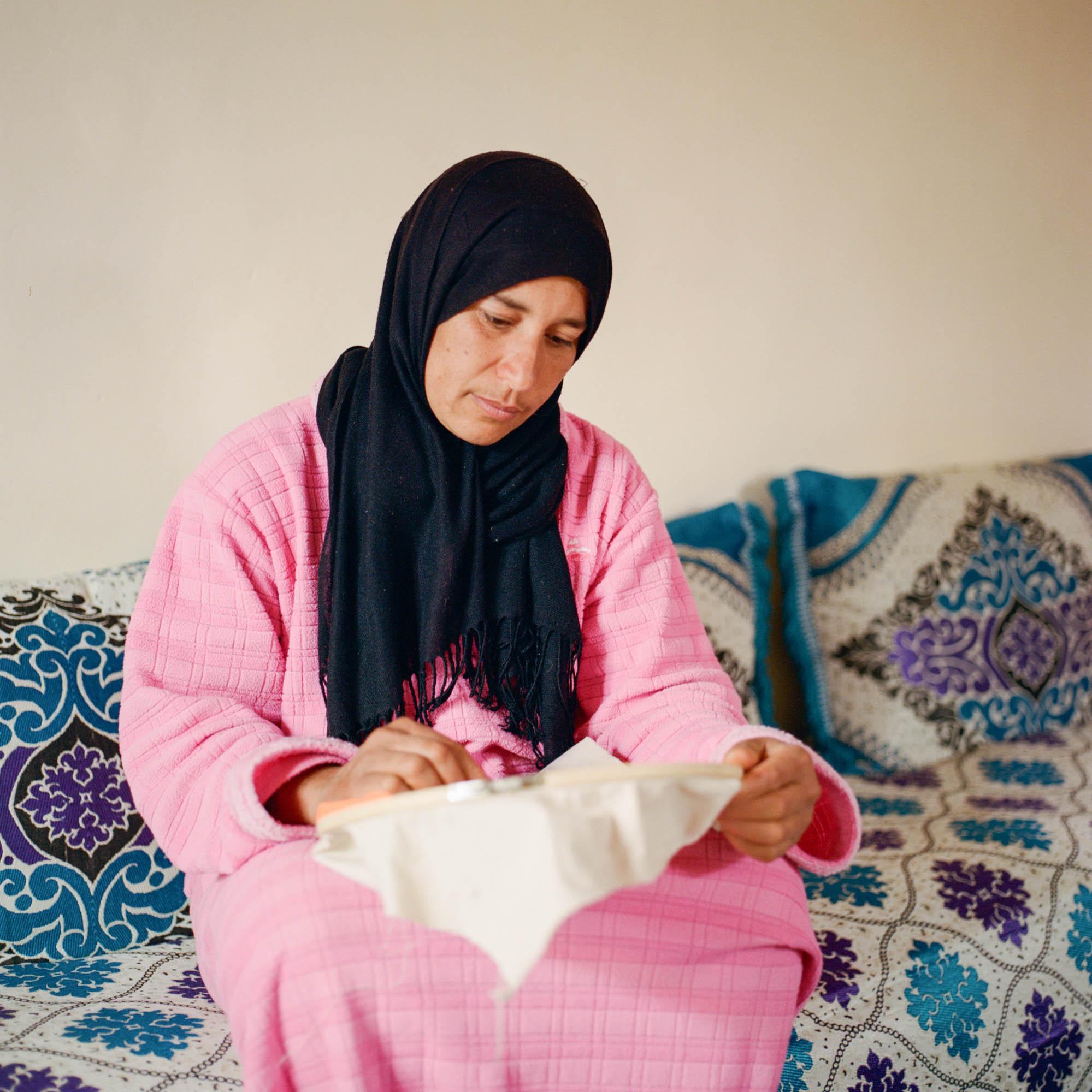 Before it's gone  - Zakia sewing peacefully at home in the oasis of Skoura  