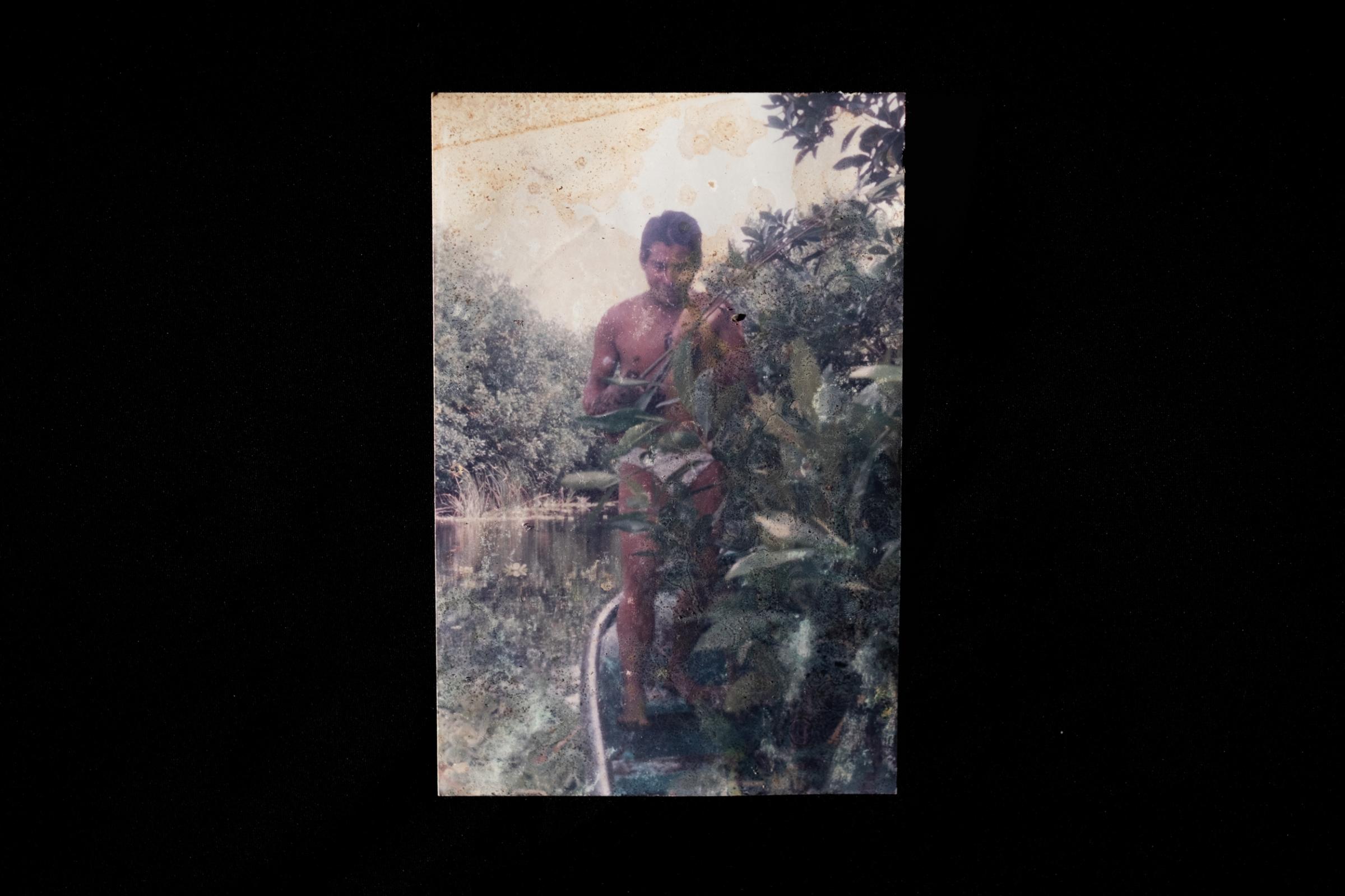 La Ventanilla: A window to coexisting with Crocodiles  - A man stands next to the mangrove forest in La Ventanilla.  From the communities archive, unknown...