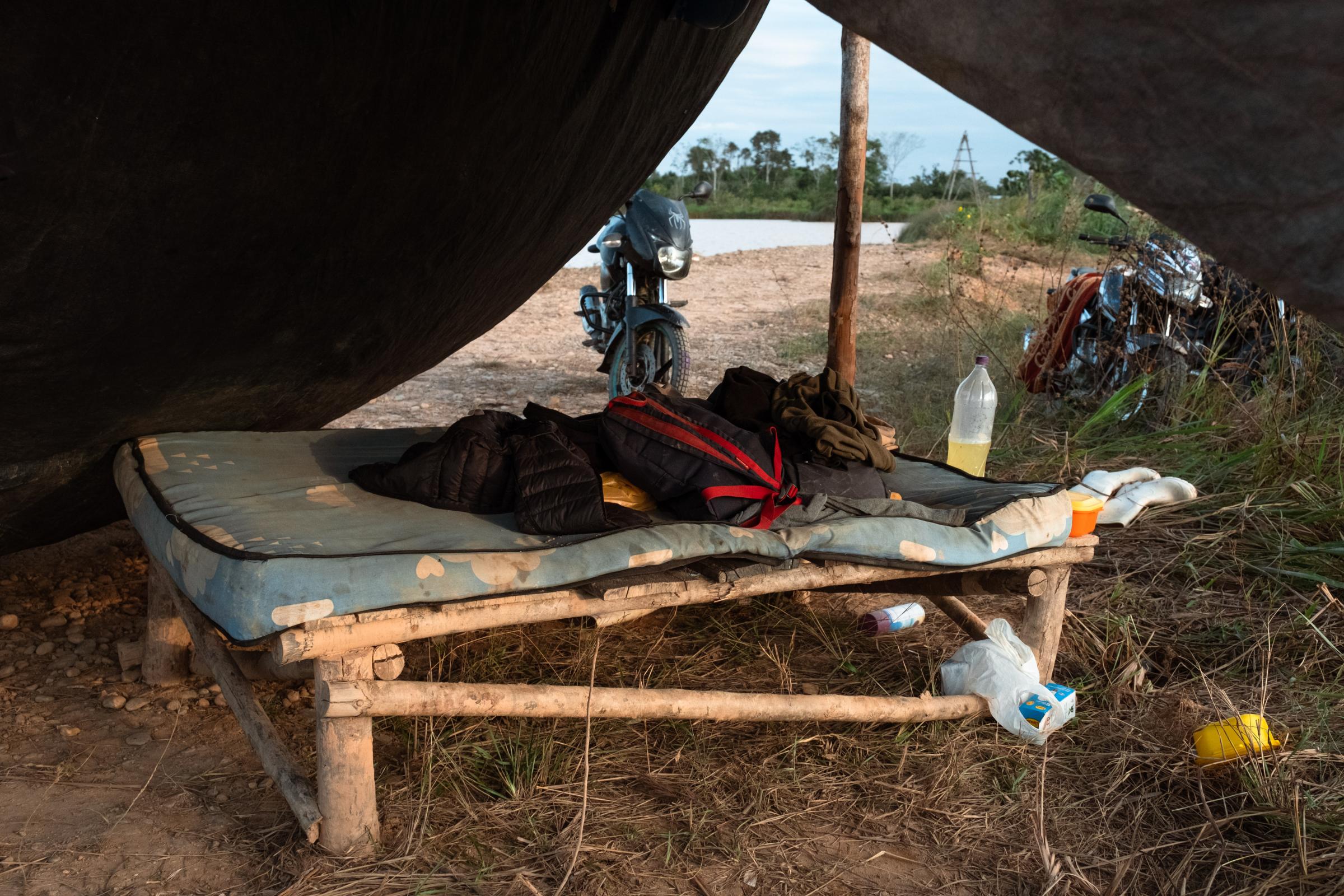Illegal Gold Mining in La Pampa - A miner's bed from the mining camp on the Inter-oceanic...