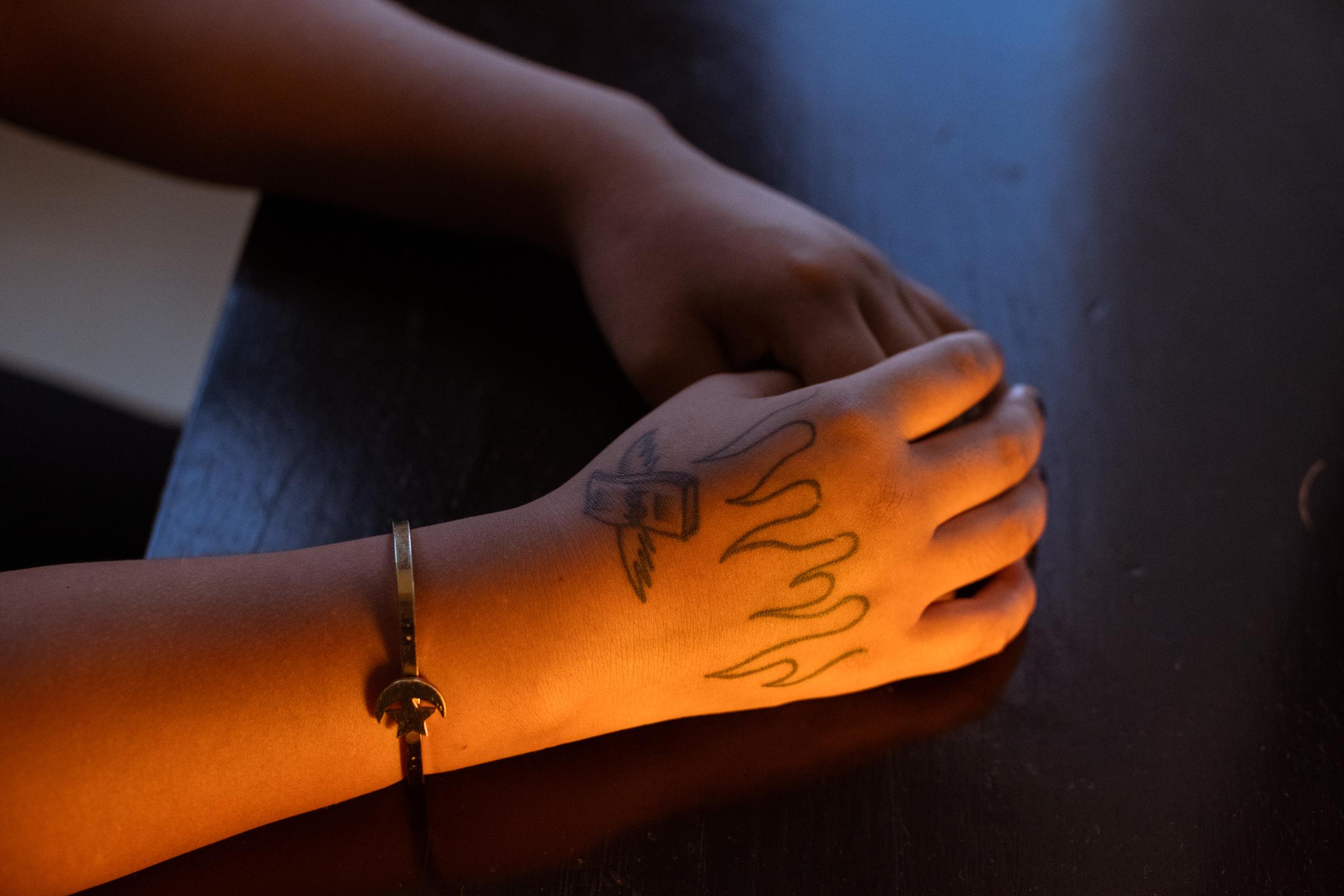 Illegal Gold Mining in La Pampa - Detail of the tattoos on Celine's hand, a victim of...
