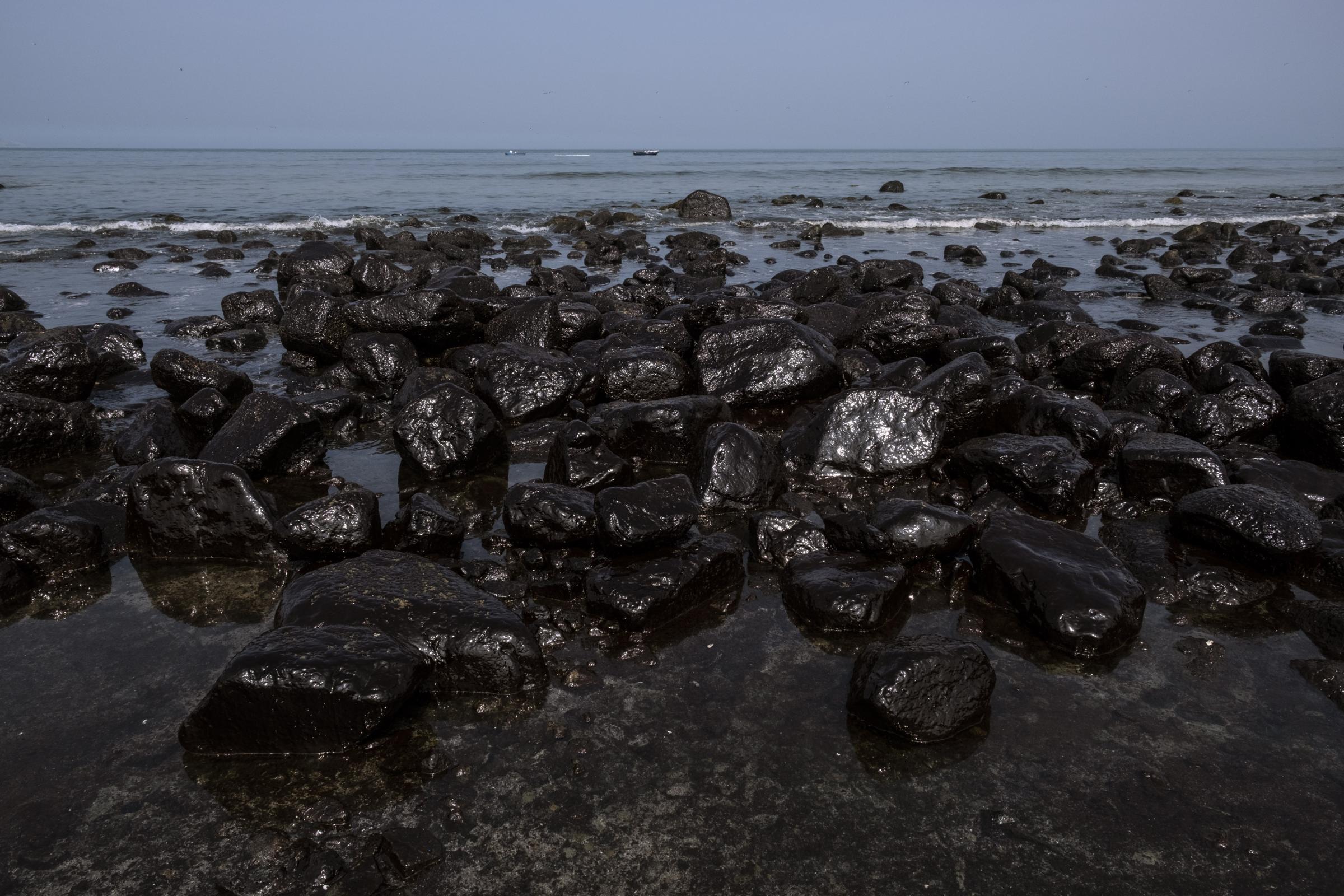 The oil spill in Peru - Crude oil on the beach of Ancon, north of Lima.