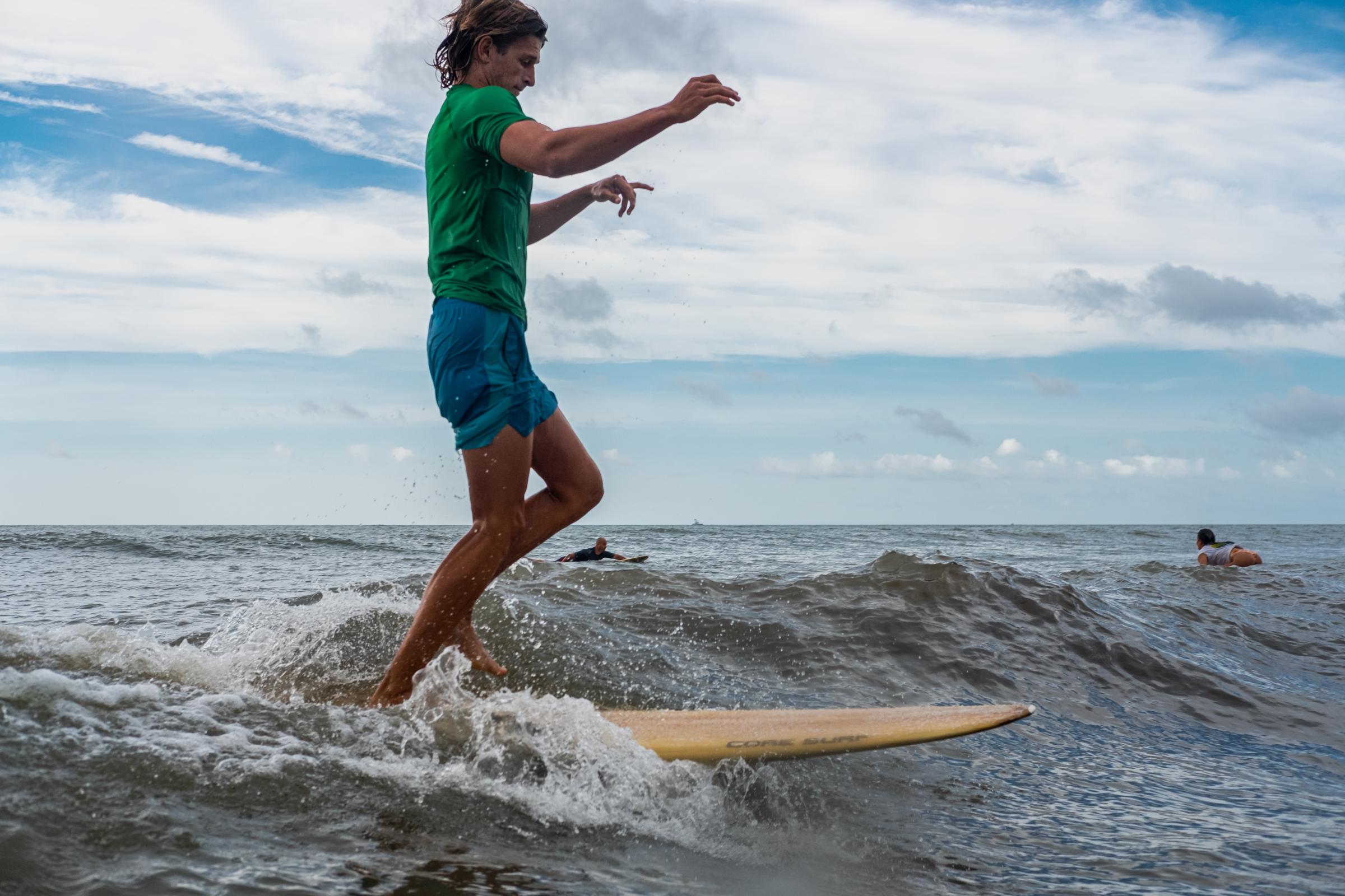 Keller Shogren walking on a 1960s longboard at the Third Annual Hotdogzonastix Surf Contest presented by Core Surf. Cape Canaveral, FL. July 3,...