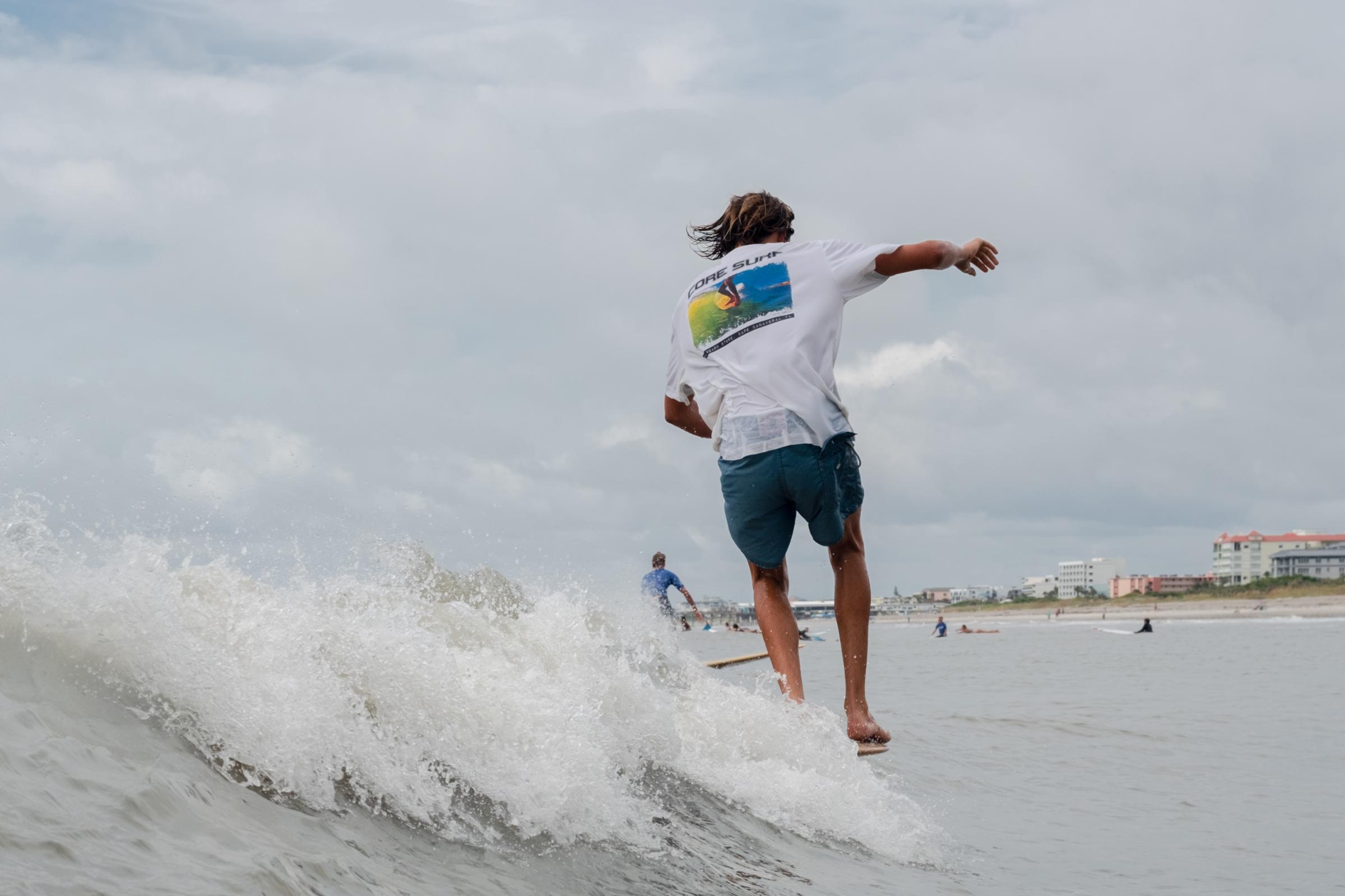 Cape Canaveral, FL. Hotdogzonastix Surf Contest July 2021 -  Skye Blumenfeld with toes on the nose on a 1960s...