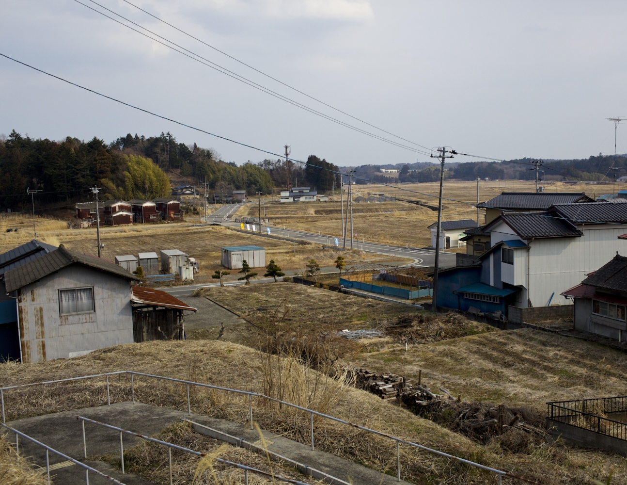 Life within 90 km -  Abandoned homes sit in an empty radiation-contaminated...