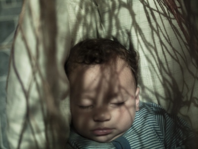 Image from Children having Children -  Anderson sleeps peacefully in a hammock in the middle of...