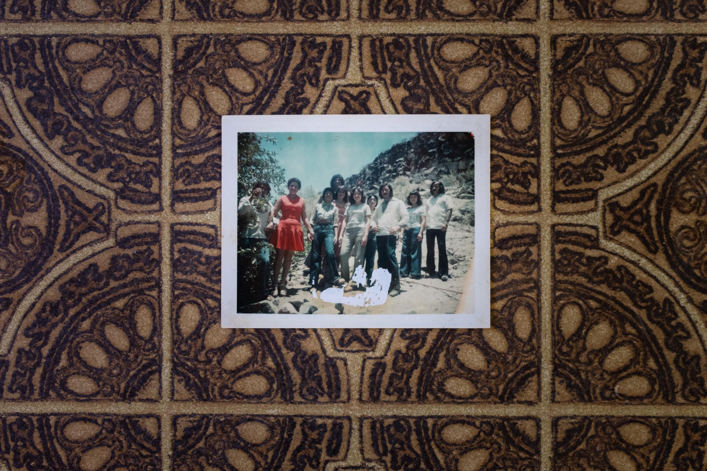Until We Are Gone  - An archival photo lies on an old table at Chancha's...