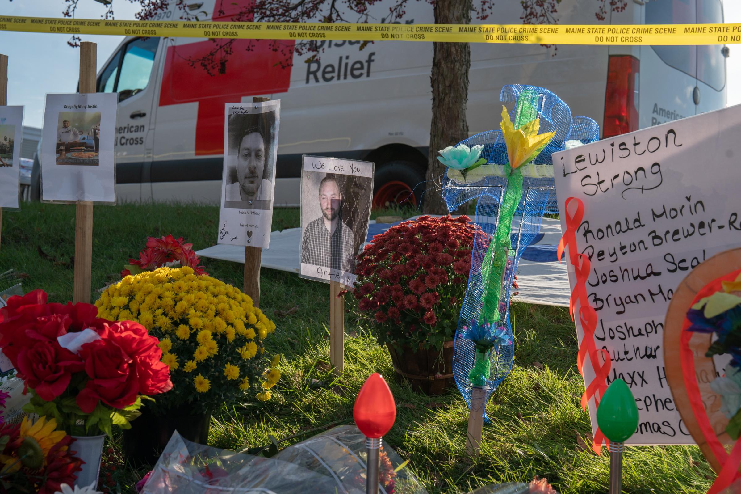 Wash Post - Aftermath of Lewiston Shooting  - Decorative memorabilia on display outside of Schemengees...