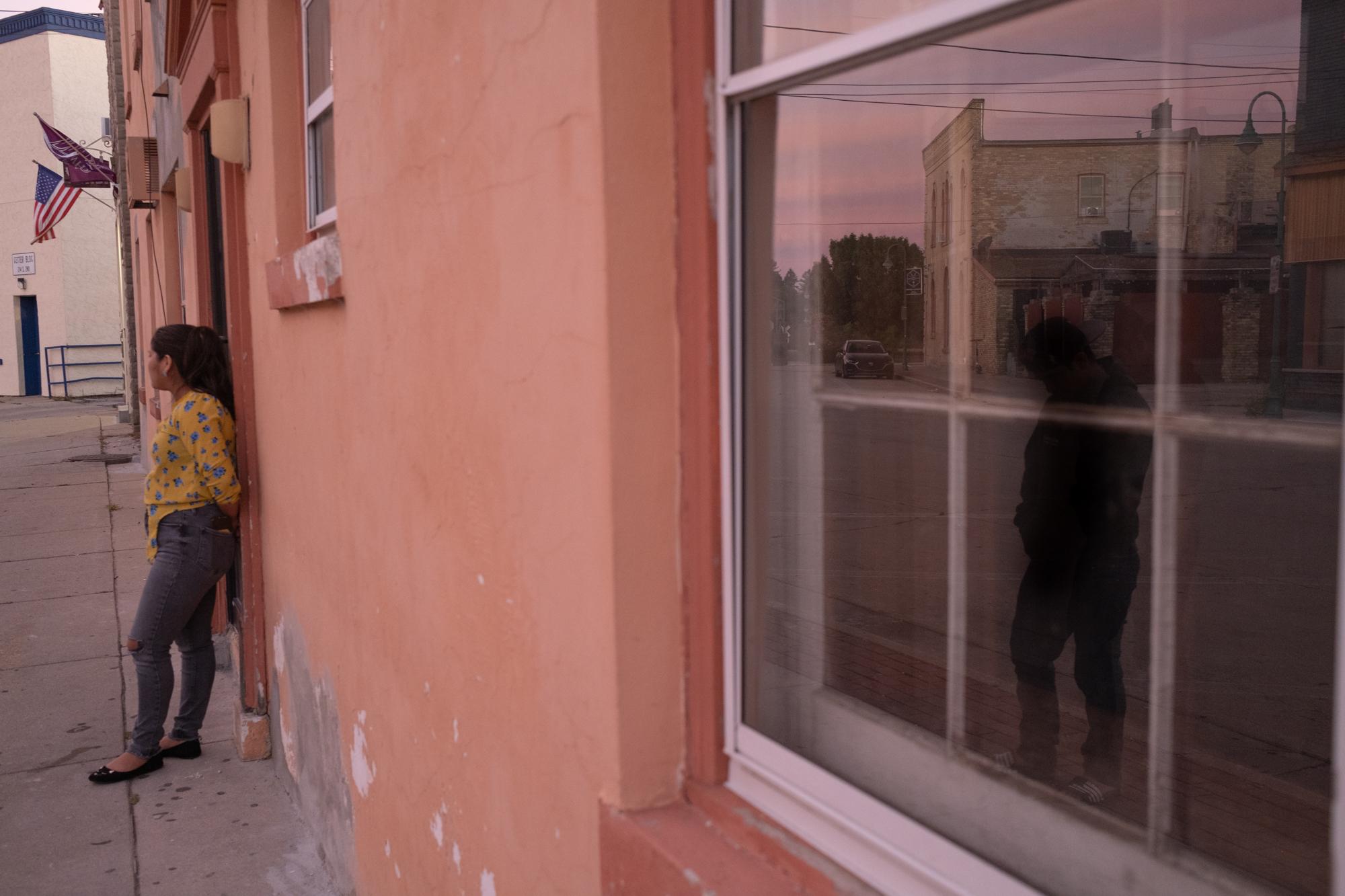 ProPublica - Immigration  - Henry and Hailey stand outside the building where they...