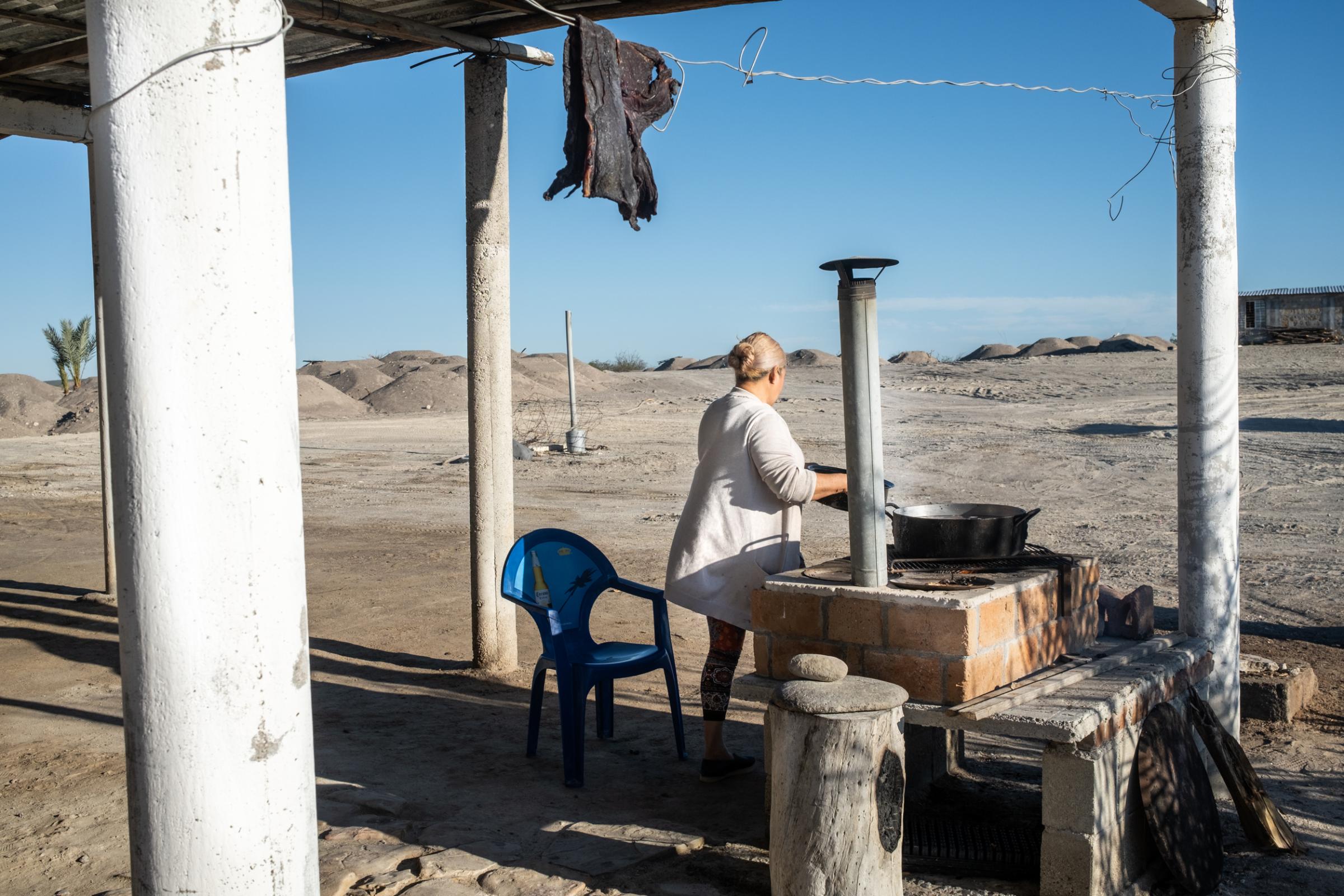 Wider project Until We Are Gone - Lidia cooks outside her house, at her ranch, for her...