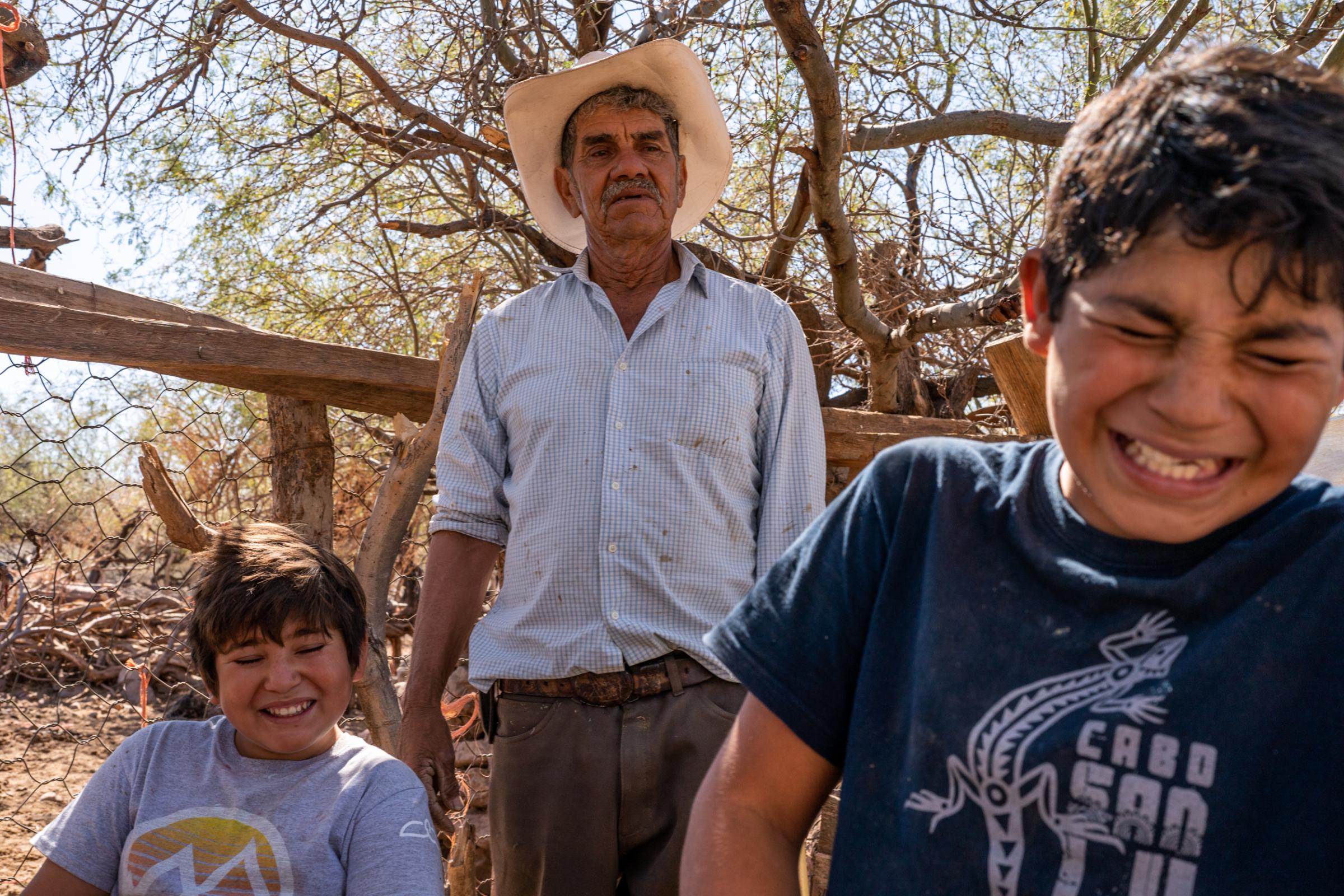 Wider project Until We Are Gone - Alejo and his grandchild fix the fence where he keeps the...