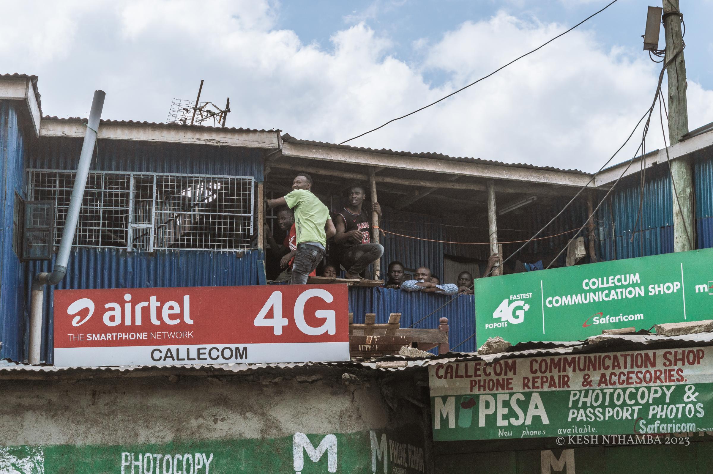 Anti-government Kibera Protests - Onlookers in Kibera witness the clash between protestors...
