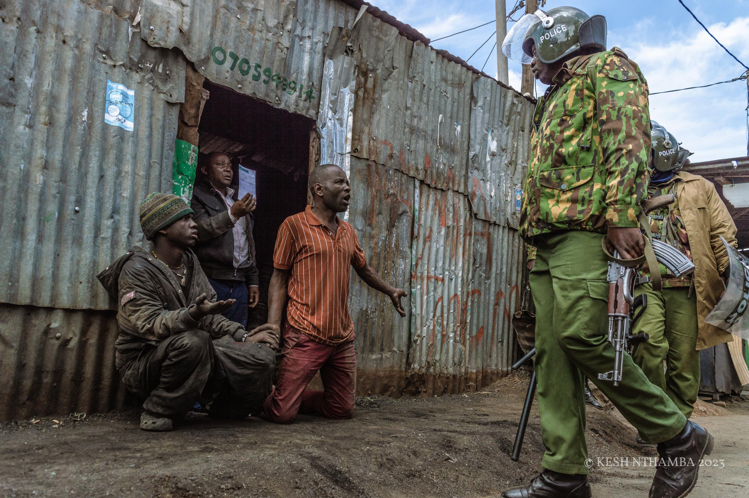 Anti-government Kibera Protests - Police interogate suspected protestors in Kibera during...