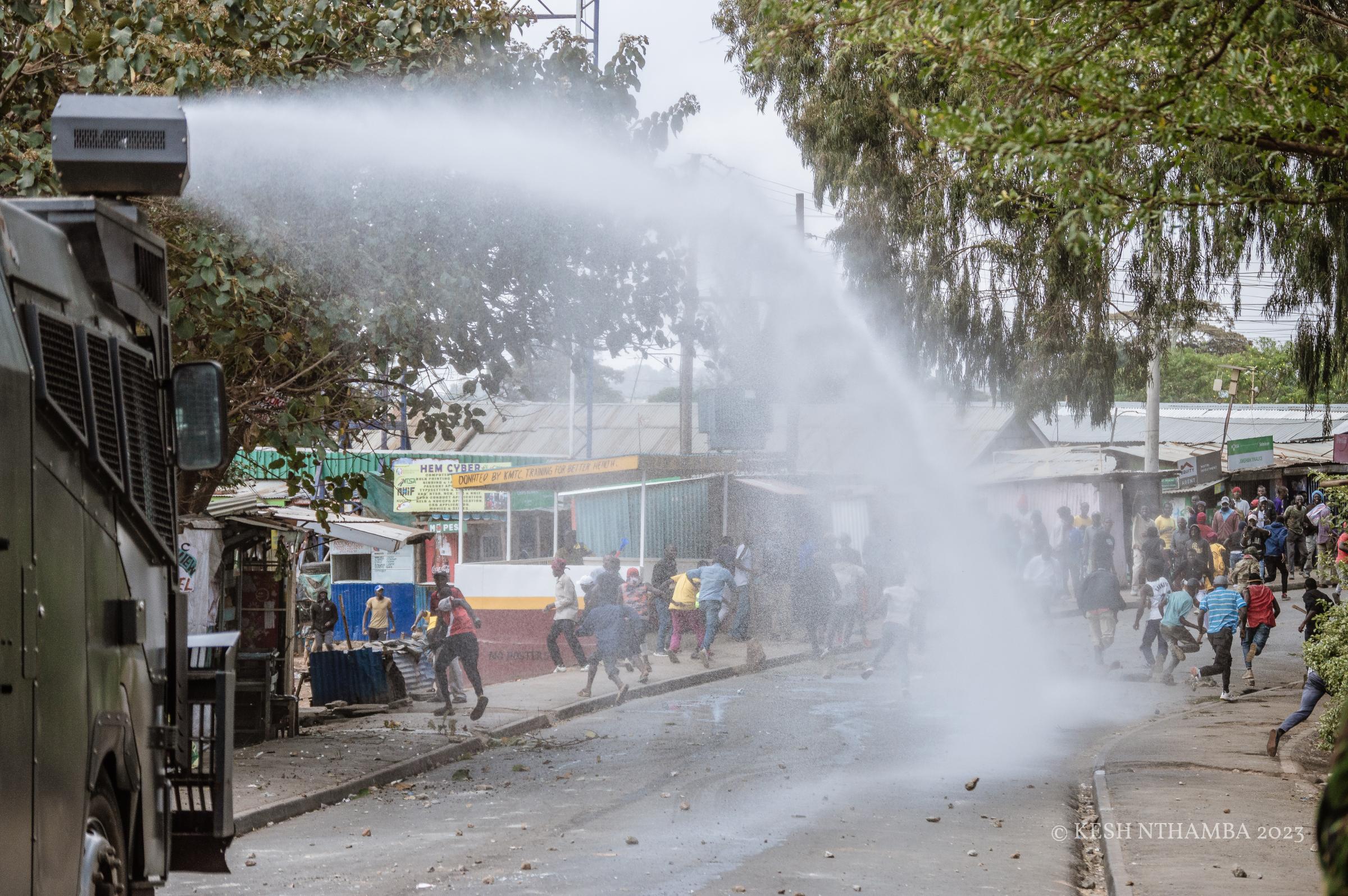 Anti-government Kibera Protests - Police spray a water cannon to disperse protestors during...